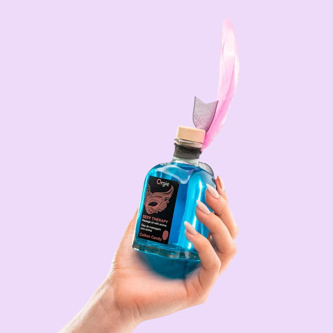 Набір для масажу Orgie – Sexy Therapy Cotton Candy (100 мл), їстівна розігрівальна олія + пір'їнка